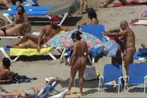 Girls on a nude beach in Sitges, Spain