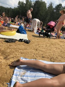 Milf in a Swimsuit Reading a Book at a Beach