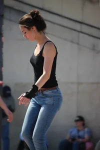 Hot brunette skateboarder in tight jeans and with hard nipples