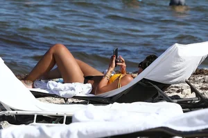 Frankie Bridge nip slips in a bikini on the beach