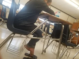 College Girl's Feet in Slippers Under Desk Closeup Photos