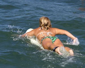 Candid surfer babes on the beach and in bikinis