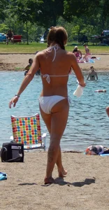 Lady with nice tits in a white bikini on the beach