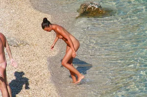 Ula FKK Sexy brunette on a nude beach topless, bottomless and with blue thong