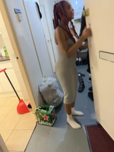 Very cute girl wearing a long tight grey dress kitchen creepshots