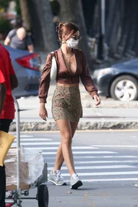 Emily Ratajkowski in mini skirt out for a walk with a friend in New York