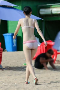 Beach Asian with camel toe and sexy body in bikini