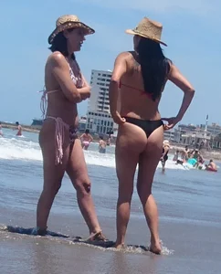 2 milfs in thong bikinis on the beach