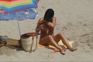 Girls on a nude beach in Sitges, Spain