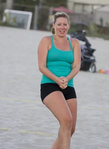 Hot girls playing beach volleyball in bikinis and shorts