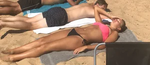Swedish beach babe in pink and black bikini