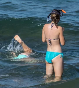 Another sexy girl on the beach snorkeling