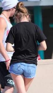 Candid skinny college girl in denim shorts showing some cheeks
