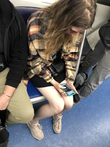 Very cute candid girl with very pale skin sitting in a subway train creepshots
