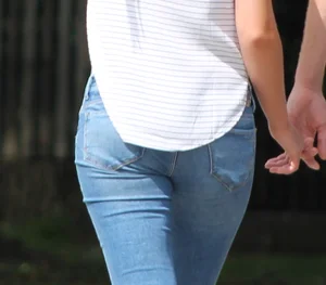 Blonde chick walking with her boyfriend in tight jeans