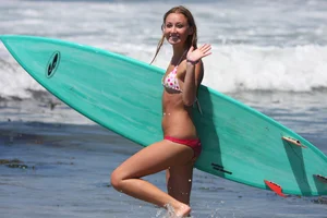 Candid surfer babes on the beach and in bikinis