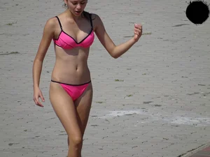 Beautiful and sexy teen in pink thong bikini