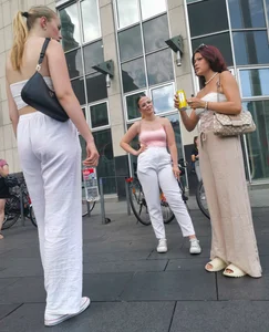 Long blonde braless in a white outfit (many pictures)