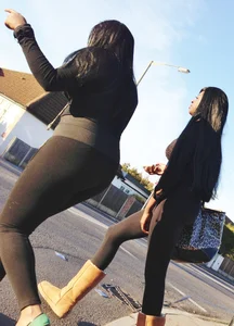 2 sexy black girls in leggings with nice asses