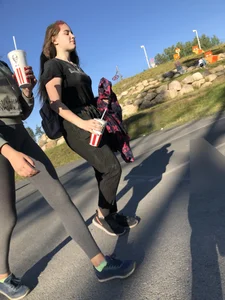 Skinny Girl in Grey Leggings Walking Past the Camera Candid Photos Gallery