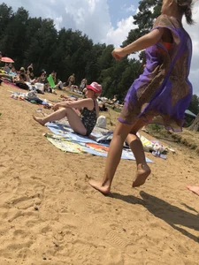 Barefoot Girl in a Dress Running Past Camera at a Beach Series