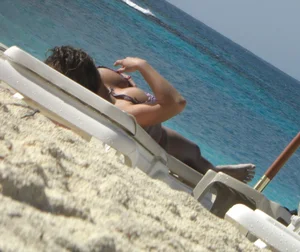 Lady with big tits wearing pink thong on the beach