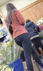 asian round booty looking for flowers at Trader joes