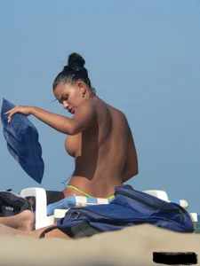 Hot ass topless beach girl with great tits lets her little brother oil up her ass in thong bikini