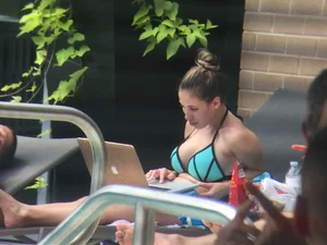 Hot girl at the pool in her bikini with big tits