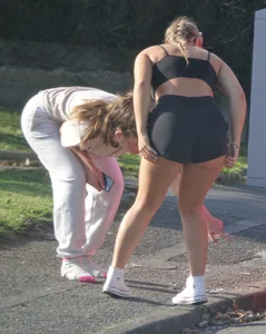 Girl in shorts bends over