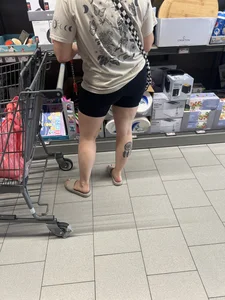 Milf in black biker shorts and flip flops