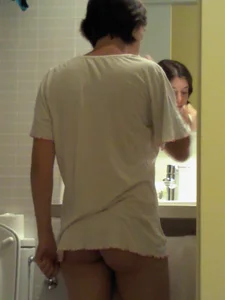 Girl in a T-Shirt And Panties Brushing Her Teeth in the Bathroom Home Spy Photo
