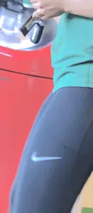 Latina in Nike leggings at the wing shop
