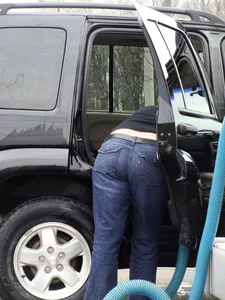 Girls cleaning their cars in jeans and pants