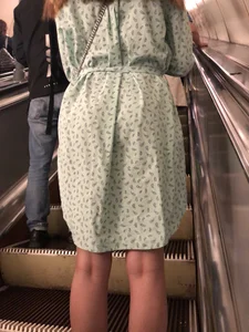 Girl in a Dress With Sexy Legs in Subway and on a Street