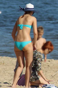 Couple of hot babes hanging out at the beach in bikinis