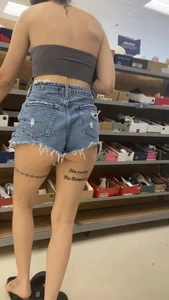 Slim Latina ass peeking out of shorts