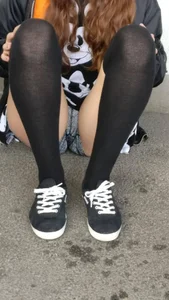 Girl With Sexy Legs in Stockings and Mini Shorts Sitting on the Ground Creepshots