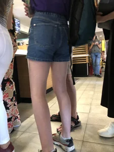 Hot Bare Legs in Blue Denim Shorts Closeup Candid Pics Gallery in the Cafe Line