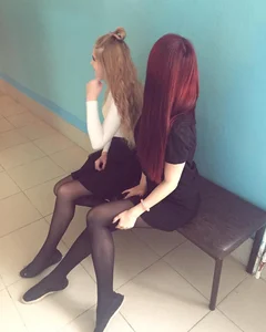 Two Skinny College Girls in Skirts, Flats and Black Pantyhose Sitting on a Bench