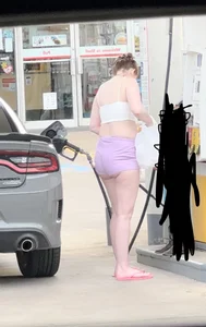 Milf with ass cheeks hanging out of her shorts at the gas station