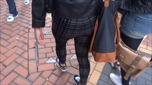 Beautiful and sexy blonde shopping in patterned leggings with a sweet ass