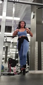 Bending gym babe stern face