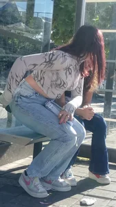 Hot girl wearing jeans at a bus stop street creepshot