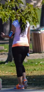 Thick lady walking in leggings with a big booty