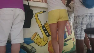 Milf in yellow shorts with vpl and a wedgie