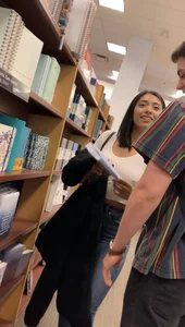 Pretty babe in tight jeans showing nipples in book store w bf (Not OC)(Face shot)