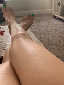 Crossed Legs and Feet With Painted Fingernails Closeup Selfie Photo