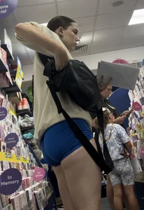 Stunning cheeked up gym girl shopping in blue shorts (OC)