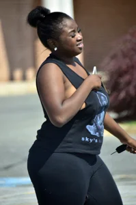 Chubby black lady with big tits and no bra lets it slip